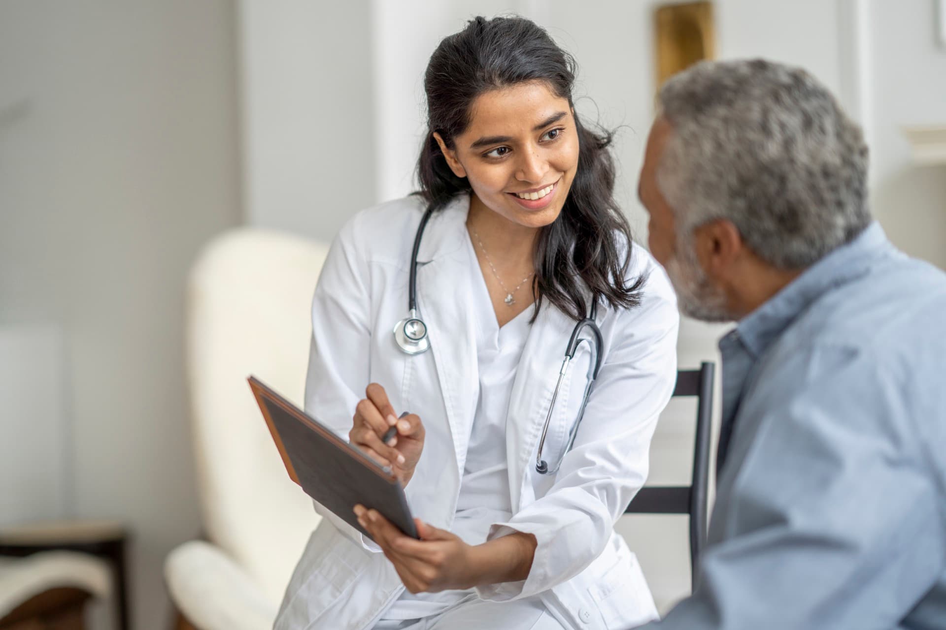 Healthcare professional consulting with a patient